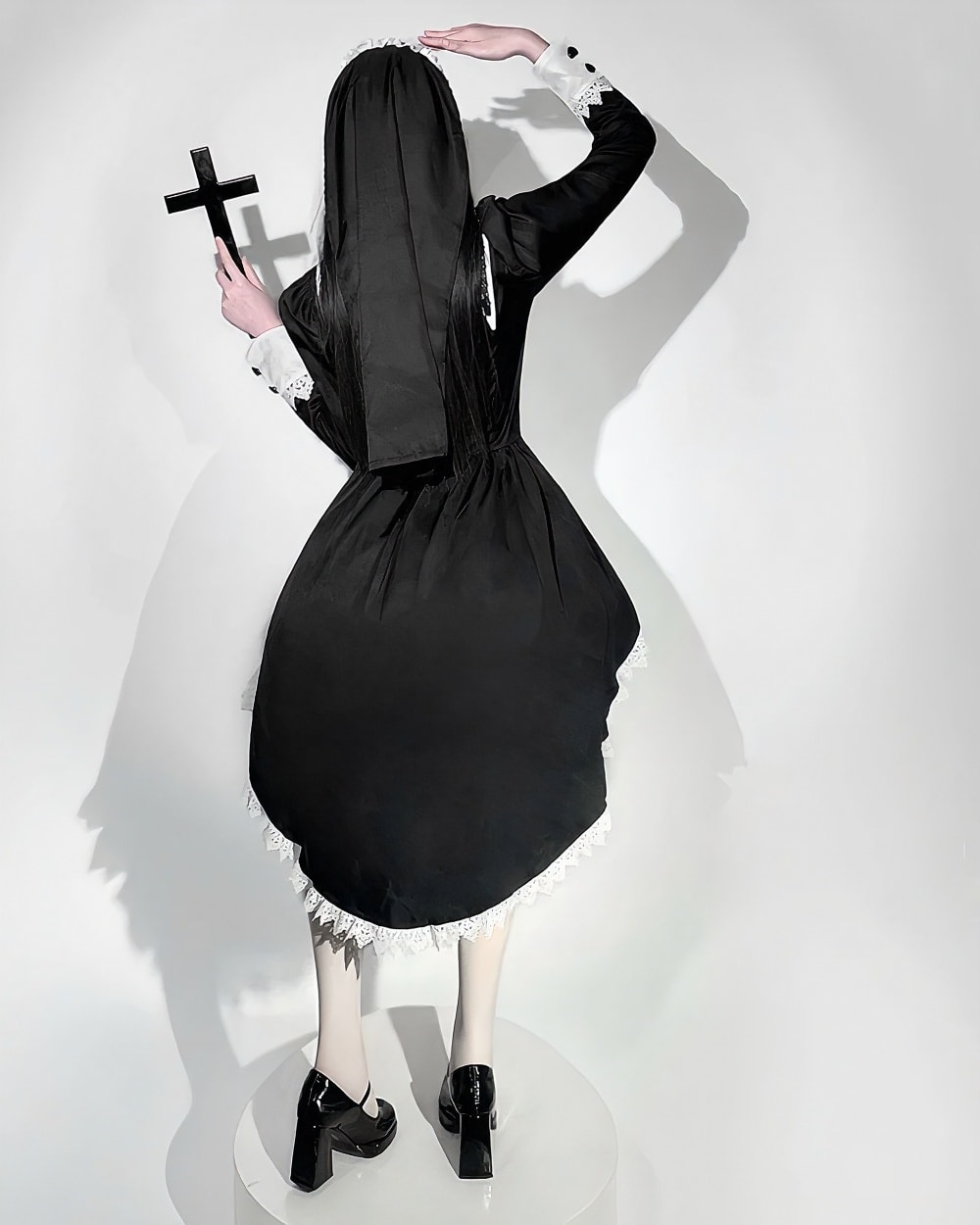 Black Gothic Nun Dress featuring a long veil and lace trim. A gothic aesthetic style.