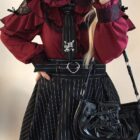 Detailed Jirai Kei Blouse featuring ruffles, lace, and embroidery. Burgundy color.