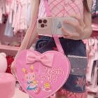 Pink Heart Shaped Cross Body Bag Jojifuku Aesthetic carried by a person.