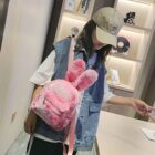 Pink Rabbit Ears Plush Backpack worn as a casual shoulder bag.
