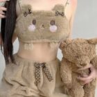A person wearing Soft Plush Bear Pajamas with a teddy bear, kawaii style loungewear.