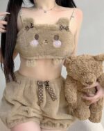 A person wearing Soft Plush Bear Pajamas with a teddy bear, kawaii style loungewear.