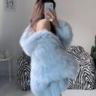 Light blue Thick Fluffy Faux Fur Coat draped over a chair.