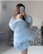 Light blue Thick Fluffy Faux Fur Coat draped over a chair.