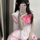 A person wearing a pink Kawaii Maid Uniform Set with a white apron and headband.