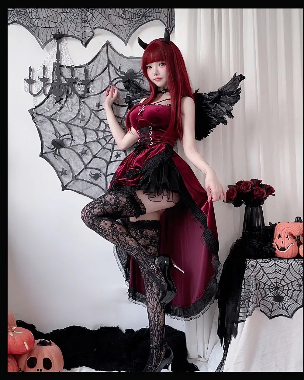 Model wearing a Dark Nun Dress, a romantic goth aesthetic dress with velvet and lace details.