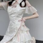 Close-up of a white Qi Lolita Dress featuring lace details and ruffles.