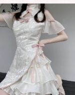 Close-up of a white Qi Lolita Dress featuring lace details and ruffles.