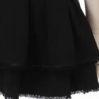 Close-up of a black Jirai Kei Skirt featuring ruffles at the hem.