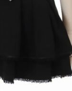 Close-up of a black Jirai Kei Skirt featuring ruffles at the hem.