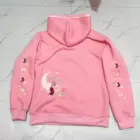 Pink Mezzo Piano Hoodie - Sweets Edition, featuring doughnuts and stars on a pink sweatshirt.