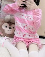 Mezzo Piano Shirt featuring a pink strawberry design, long sleeve, and Jojifuku aesthetic.