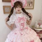 Model wearing a pink Frilly Ribbon Dress - Hime Lolita Dress, featuring ruffles and a bonnet.