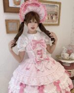 Model wearing a pink Frilly Ribbon Dress - Hime Lolita Dress, featuring ruffles and a bonnet.