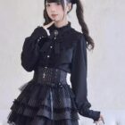 Dark Lolita Set: Black ruffled blouse, corset, and skirt with lace details. Girly Kei aesthetic.