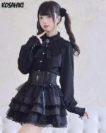 Dark Lolita Set: Black ruffled blouse, corset, and skirt with lace details. Girly Kei aesthetic.