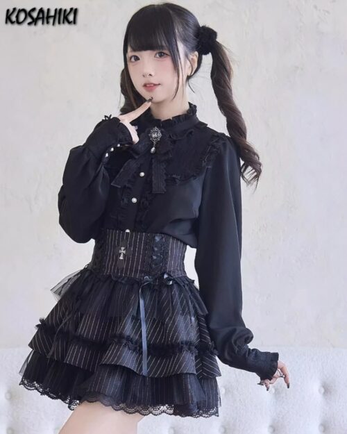 Dark Lolita Set: Black ruffled blouse, corset, and skirt with lace details. Girly Kei aesthetic.
