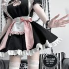 Black and pink Kawaii Maid Dress with frills and lace, worn by a model.