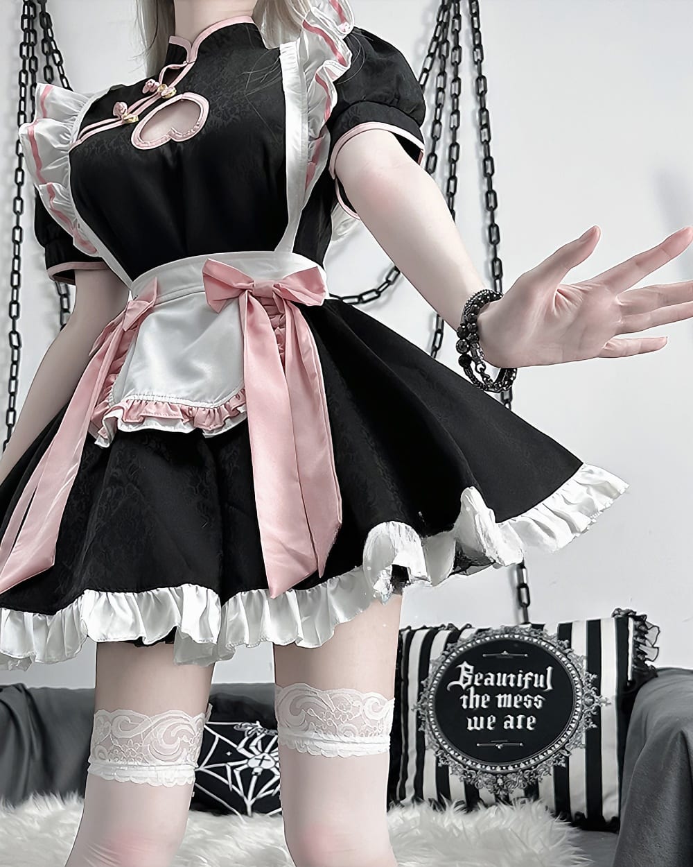 Black and pink Kawaii Maid Dress with frills and lace, worn by a model.