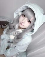 Model wearing a white Kawaii Gamer Hoodie with a hood and cute details.