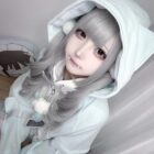 Model wearing a Long Sleeve Hoodie - Kawaii Gamer Hoodie, featuring a white color and a cute design.
