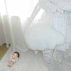 White fluffy Angel Wings Bag, Harajuku aesthetic, displayed with dolls and bedding.