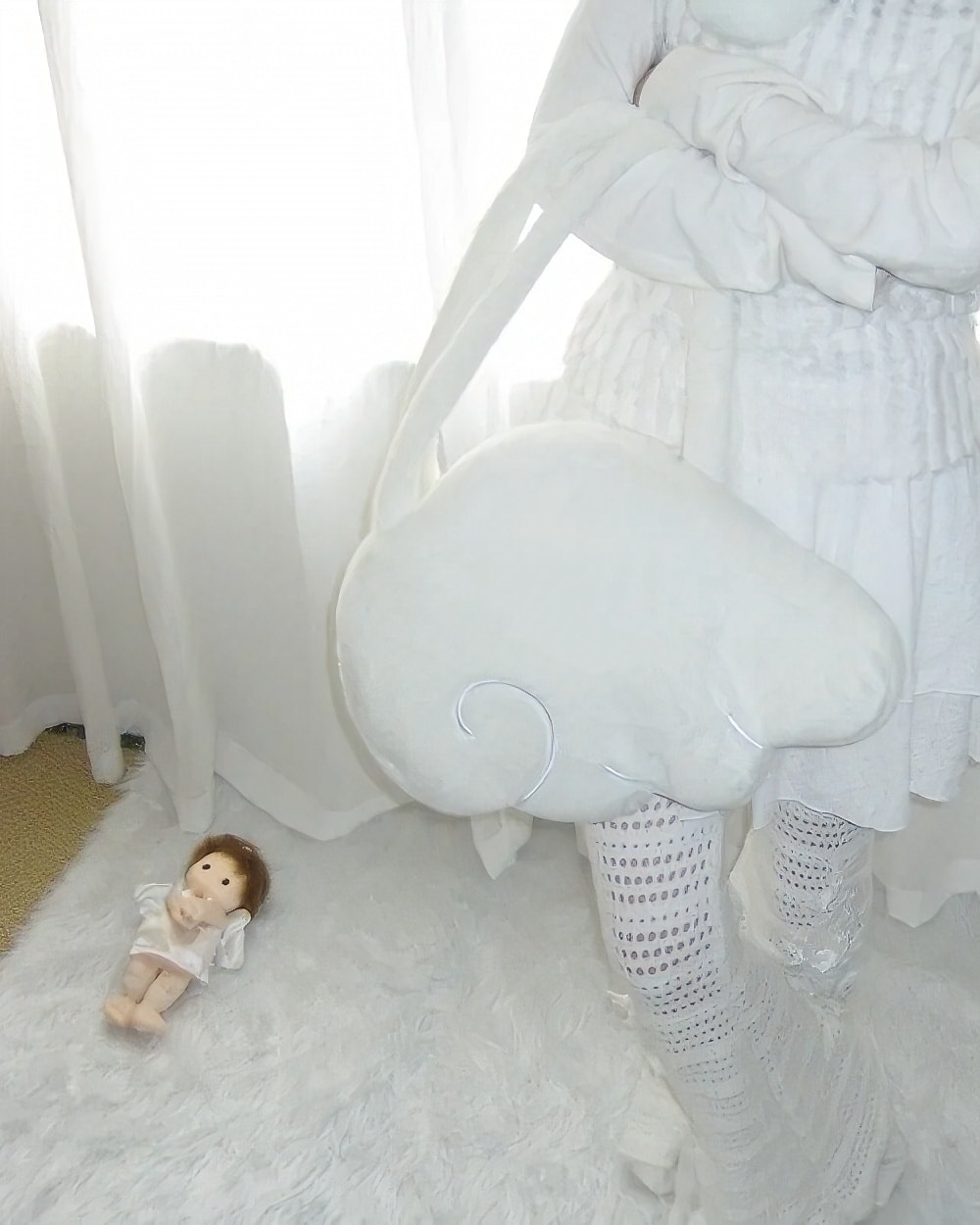 White fluffy Angel Wings Bag, Harajuku aesthetic, displayed with dolls and bedding.
