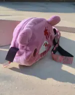 Pink Gloomy Bear Plush Bag, featuring a zipper closure and character details.