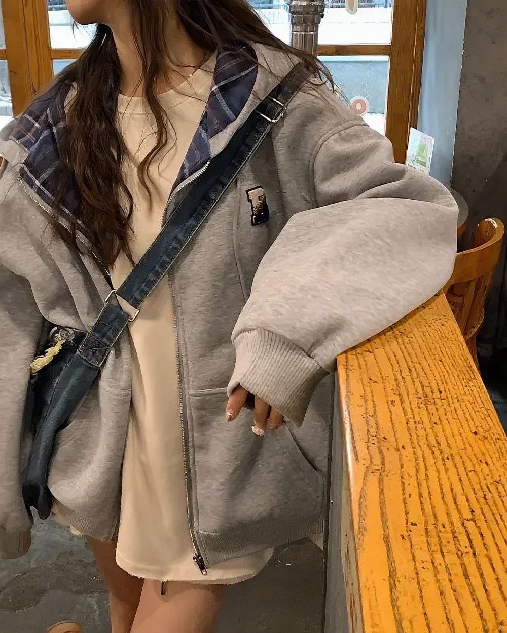 Gray Preppy Aesthetic Hoodie worn by a woman, featuring a zip-up design and large sleeves.