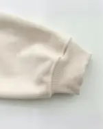 Close-up of an Ethno-Chic Hoodie sleeve showing ribbed cuffs.