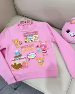 Pink Mezzo Piano Sweatshirt featuring Mimi's Cafe, PoPo's Bakery, and MimiPopo Town designs.