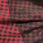 Close-up of a Grunge Plaid Skirt featuring a red and black plaid pattern.