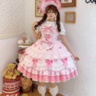 A pink Hime Lolita Dress with ruffles, ribbons, and a matching hat, styled with accessories.