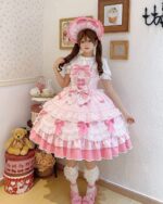 A pink Hime Lolita Dress with ruffles, ribbons, and a matching hat, styled with accessories.