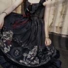 Black Gothic Lolita Dress featuring a detailed print and layered skirt.