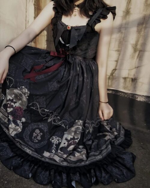 Black Gothic Lolita Dress featuring a detailed print and layered skirt.