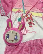 Mezzo Piano Cross Body Bag featuring a plush bunny character and musical print design.