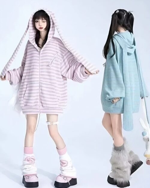 Two models wearing Long Eared Bunny Hoodie with striped zip-up jackets and matching accessories.