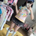 Model wearing the Mezzo Piano Print Top, a Jojifuku aesthetic blouse with playful graphics.