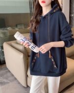 Blue Ethno-Chic Hoodie, loose fit, with decorative tassel details and floral embroidery.