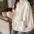 Cream-colored Ethno-Chic Hoodie with embroidered details, loose fit, and drawstring tassel.