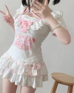 White Ruffled Cake Skirt - Yume Kawaii Skirt with pink accents and character print.