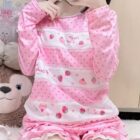 Close-up of a pink Mezzo Piano Shirt featuring strawberries, cupcakes, and a kawaii aesthetic.