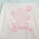 Mezzo Piano Pastel Top featuring a strawberry shortcake illustration and text.