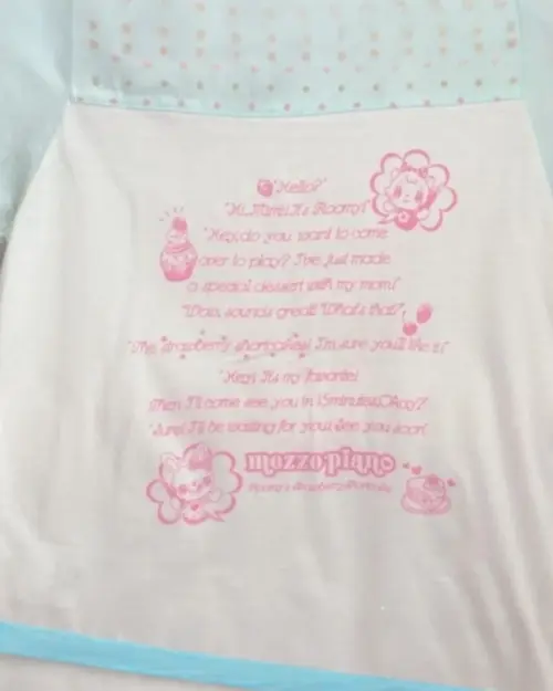 Mezzo Piano Pastel Top featuring a strawberry shortcake illustration and text.