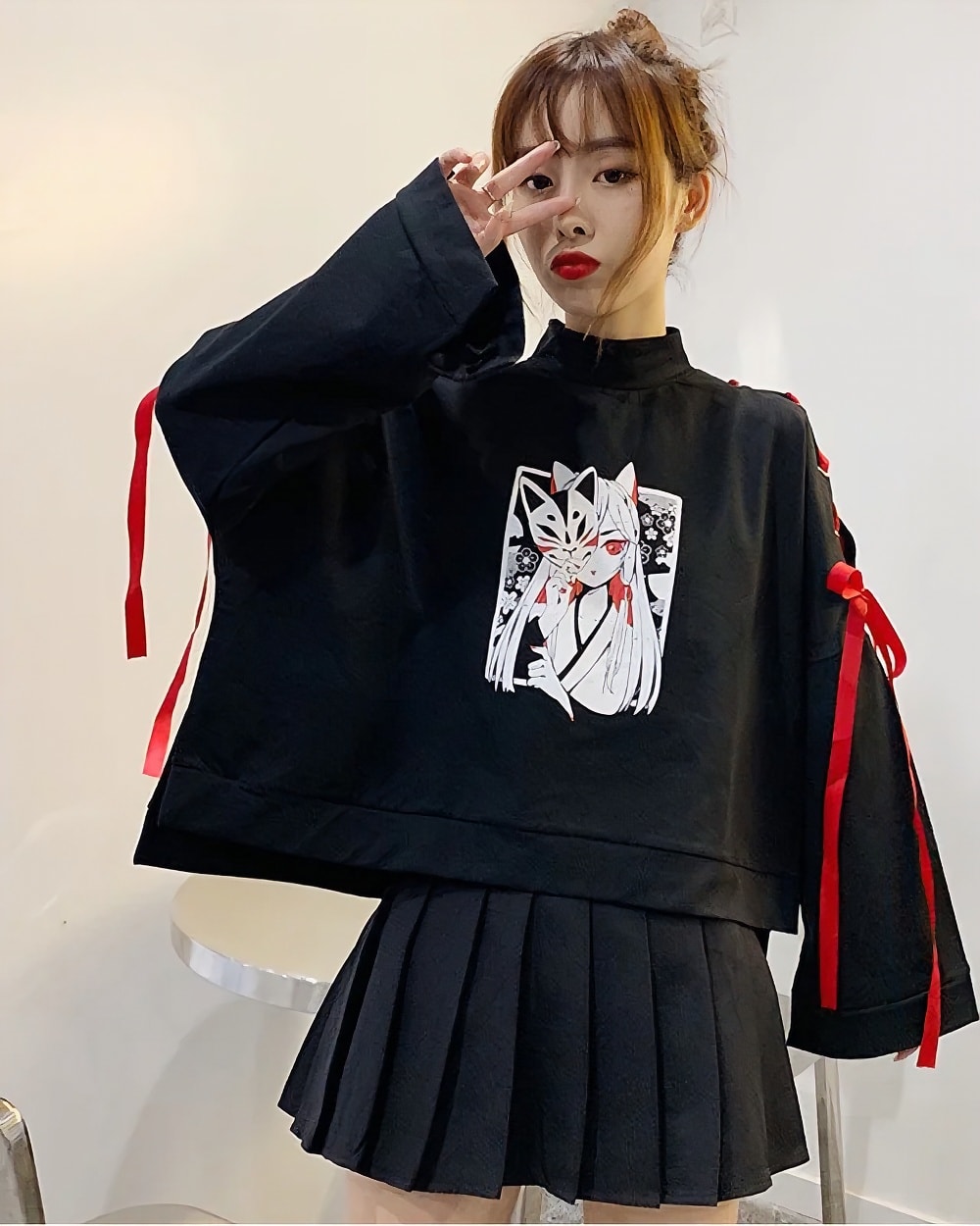 Black Kitsune Bowed Sweatshirt featuring an anime-style illustration on a long-sleeved, high-neck pullover.