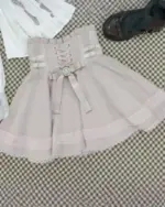 Pink Jirai Kei ruffled skirt with lace trim and bow details. Focus Keyword: Jirai Kei Set
