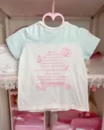 Mezzo Piano Top - Jojifuku Aesthetic, light pink shirt displayed on a hanger.