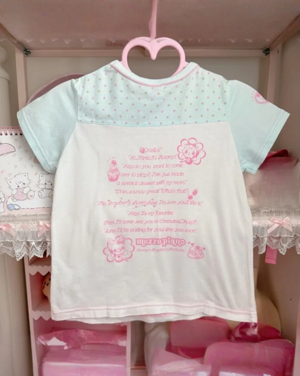 Mezzo Piano Top - Jojifuku Aesthetic, light pink shirt displayed on a hanger.