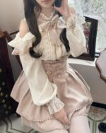 Jirai Kei Set: Beige ruffled blouse and skirt with lace detailing and a belt.